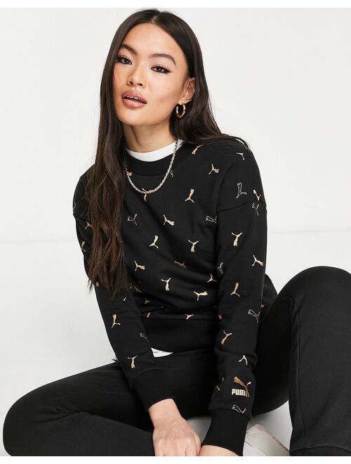 Puma Classics all over logo print sweatshirt in black and gold