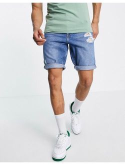 slim denim shorts in mid wash with rips