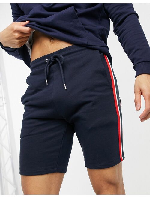ASOS DESIGN jersey skinny shorts with knitted side stripe in navy