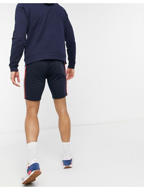 ASOS DESIGN jersey skinny shorts with knitted side stripe in navy