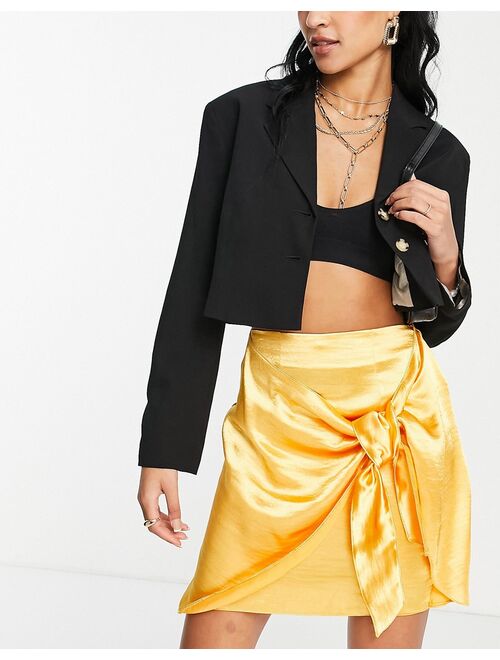 ASOS DESIGN Tall satin mini skirt with knot detail in yellow