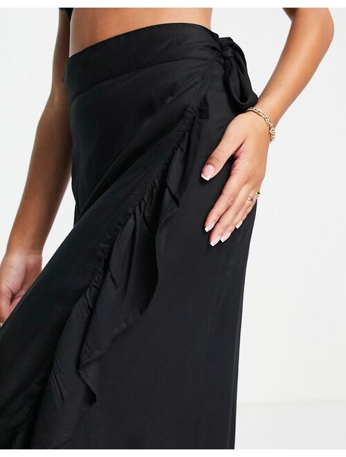 Esmee Exclusive frill beach wrap skirt in black