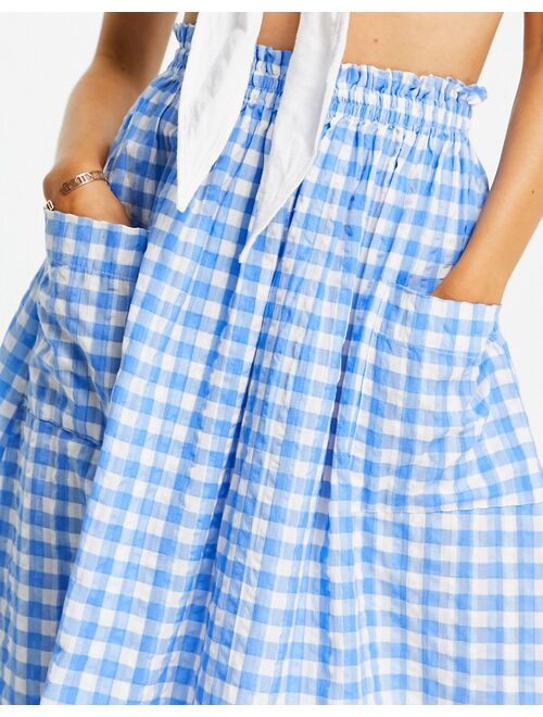 ASOS DESIGN midi skirt with pocket detail in seersucker blue & white gingham print