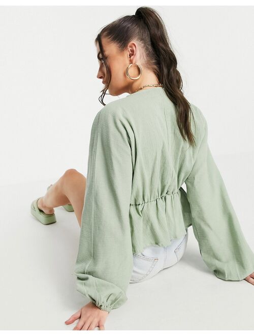 ASOS DESIGN natural crinkle lace up front top in sage