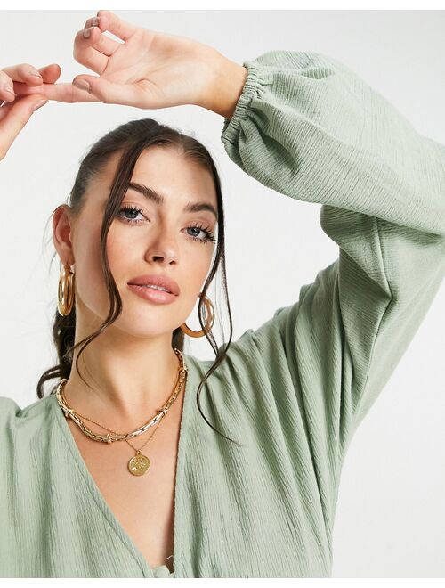 ASOS DESIGN natural crinkle lace up front top in sage