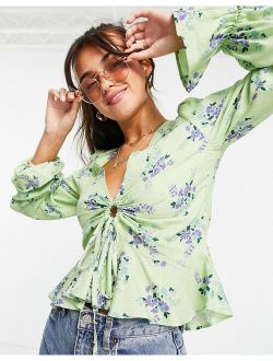 v neck long sleeve blouse with ruched front in green floral