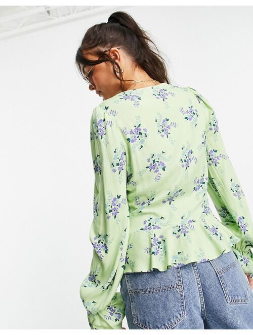 ASOS DESIGN v neck long sleeve blouse with ruched front in green floral