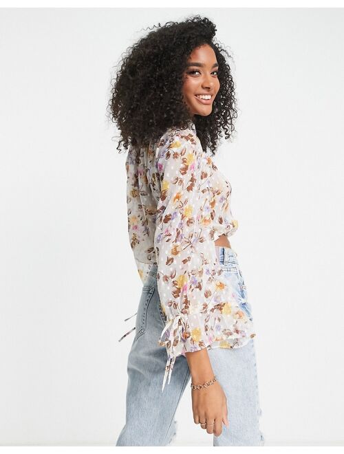 ASOS DESIGN long sleeve textured top with tie front in tonal floral print