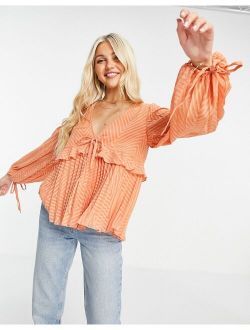 sheer v neck top with frill and tie waist detail in apricot