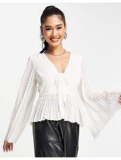 textured pleated peplum shirt with button and tie detail with long sleeve in ivory