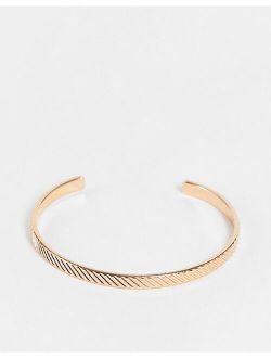 cuff bracelet with texture in gold tone