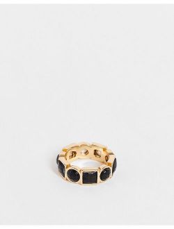 band ring with black stones in gold tone