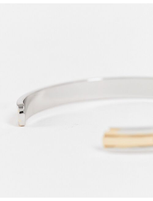 ASOS DESIGN cuff bracelet in mixed biplate silver and gold tone