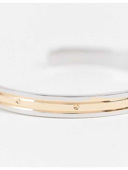 ASOS DESIGN cuff bracelet in mixed biplate silver and gold tone