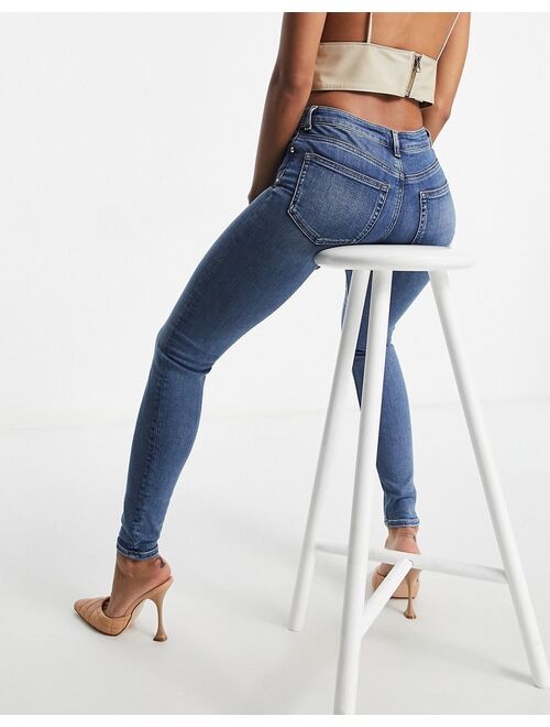ASOS DESIGN high rise ridley 'skinny' jeans in authentic midwash