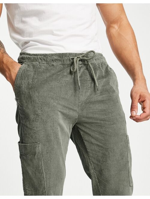 ASOS DESIGN slim pants in khaki corduroy with cargo pockets