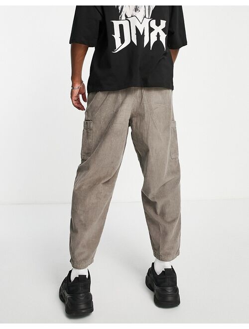 ASOS DESIGN balloon fit pants in cord with cargo pockets