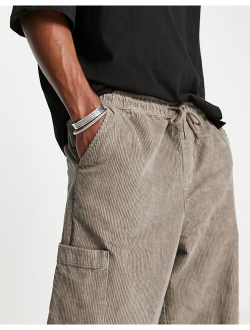 ASOS DESIGN balloon fit pants in cord with cargo pockets