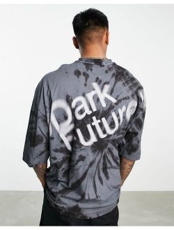 ASOS Dark Future oversized t-shirt with spiral tie dye and blurred logo graphic print in black