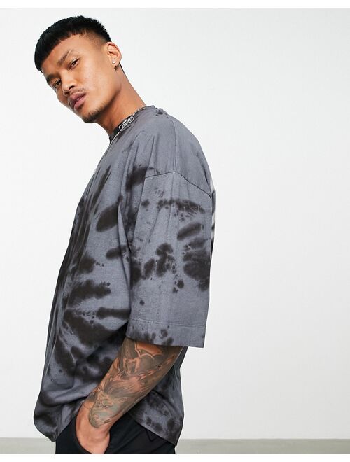Asos Design ASOS Dark Future oversized t-shirt with spiral tie dye and blurred logo graphic print in black