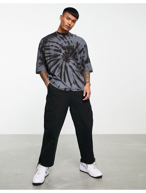 Asos Design ASOS Dark Future oversized t-shirt with spiral tie dye and blurred logo graphic print in black