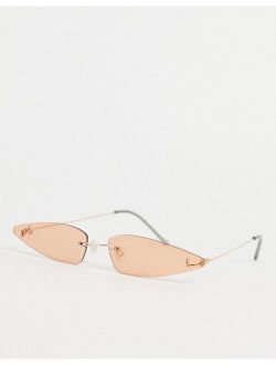 Jeepers Peepers extreme cat eye sunglasses with silver frames and pale orange lens