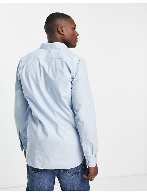 Lacoste Lacost long sleeve pocket shirt in blue
