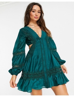voile mini dress with Guipire lace trim and lace-up back in green