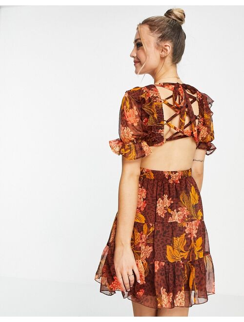 ASOS DESIGN mini dress in floral and animal mix print with lace up back detail