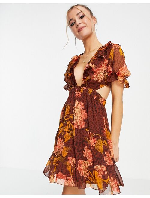 ASOS DESIGN mini dress in floral and animal mix print with lace up back detail