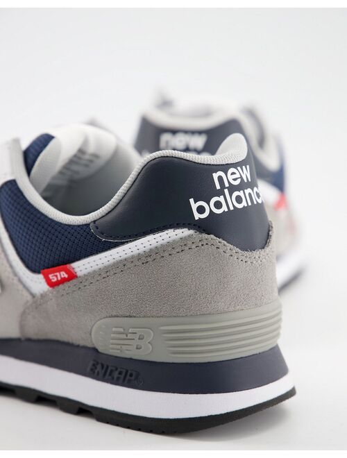 New Balance 574 sneakers in off-white and navy
