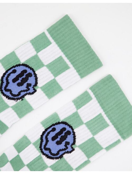 ASOS DESIGN checkerboard sports socks with wavy smiley face