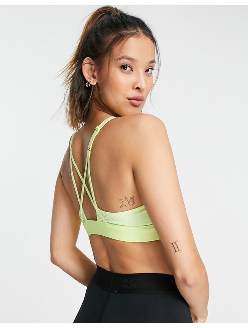 Reebok Training Lux strap back medium support sports bra in lime