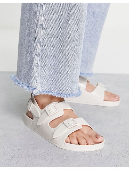 ASOS DESIGN Fate jelly flat sandals with buckles in off white