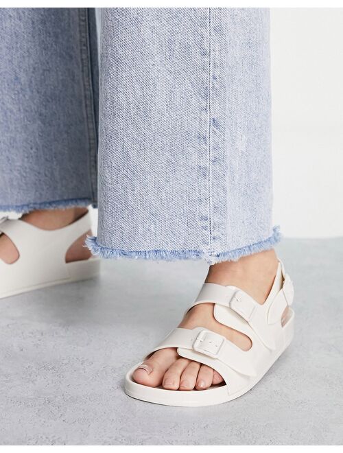 ASOS DESIGN Fate jelly flat sandals with buckles in off white