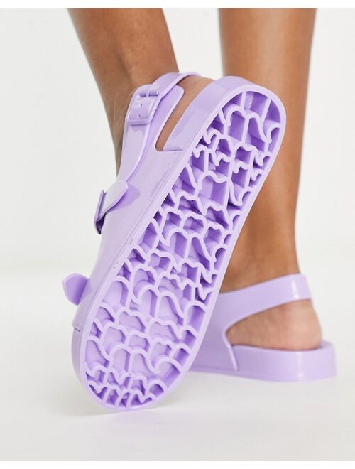 ASOS DESIGN Fate jelly flat sandals with buckles in lilac