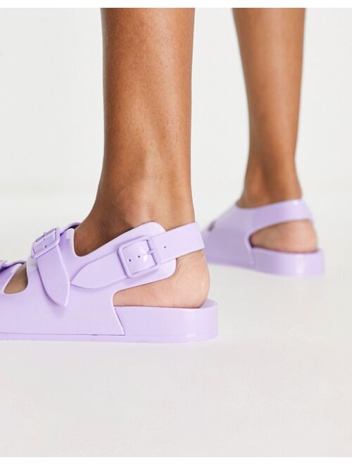ASOS DESIGN Fate jelly flat sandals with buckles in lilac