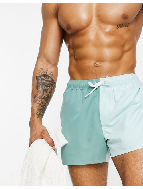 ASOS DESIGN swim shorts in color block green