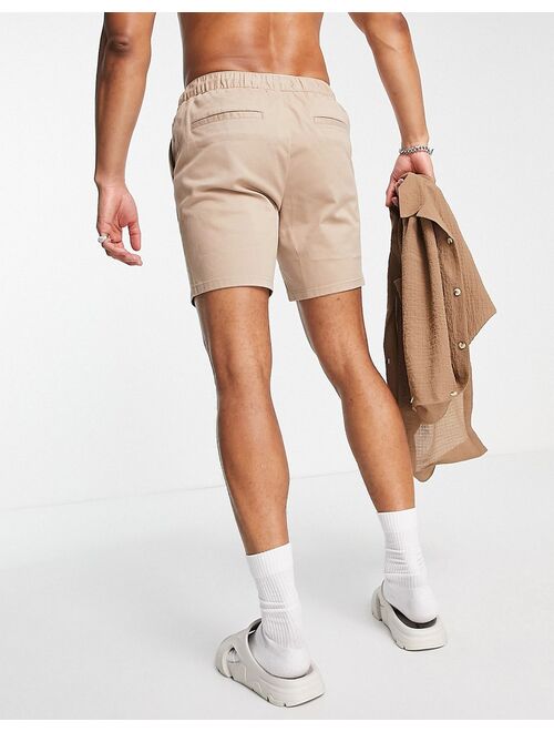 ASOS DESIGN slim chino shorts with elastic waist in beige