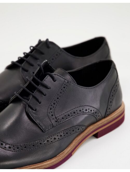 ASOS DESIGN leather brogue in black leather with contrast sole