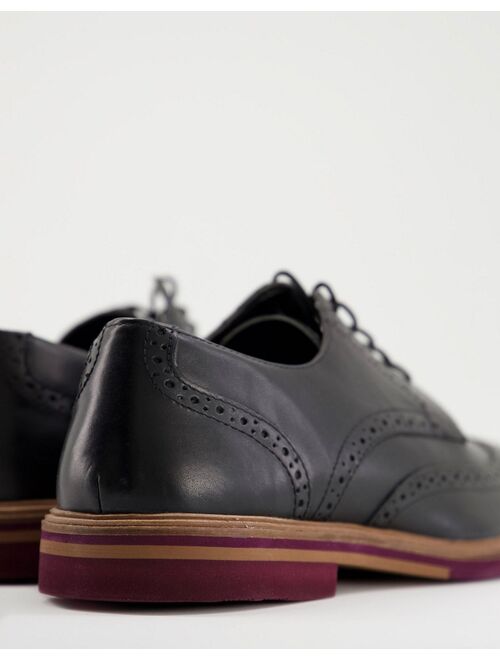 ASOS DESIGN leather brogue in black leather with contrast sole