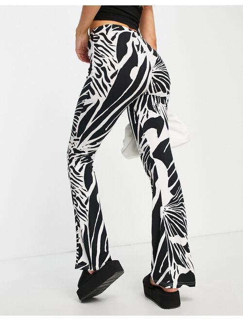 River Island abstract wing print flare pants in cream