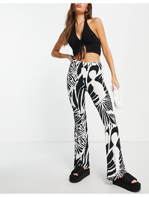 River Island abstract wing print flare pants in cream