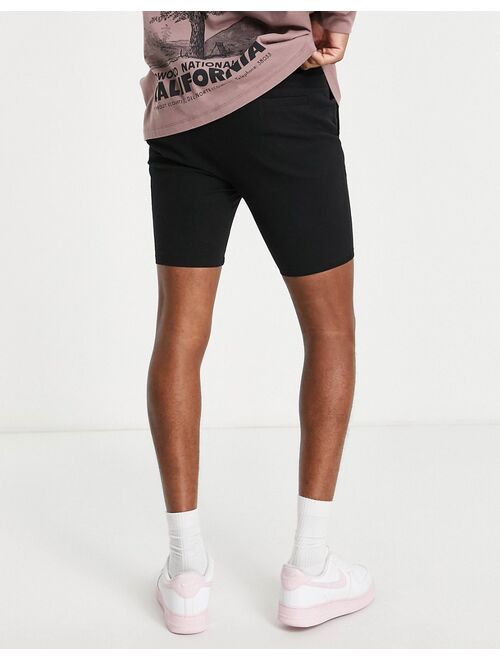 ASOS DESIGN power stretch chino shorts in black