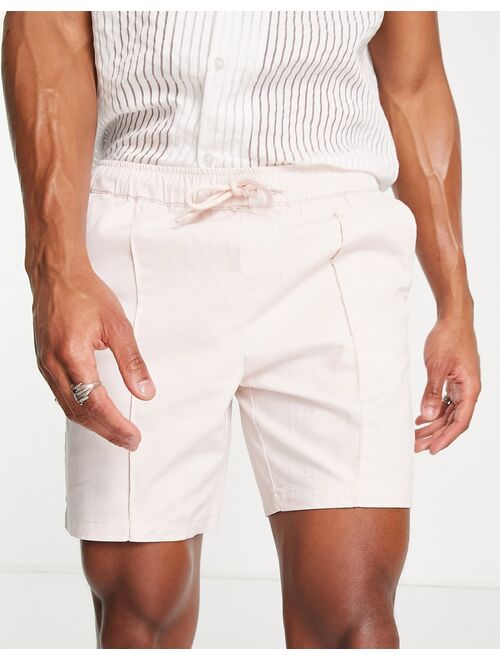 ASOS DESIGN slim chino shorts with pin tuck and elasticized waist in pastel pink