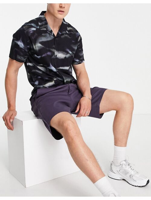 ASOS DESIGN relaxed skater chino shorts in washed navy