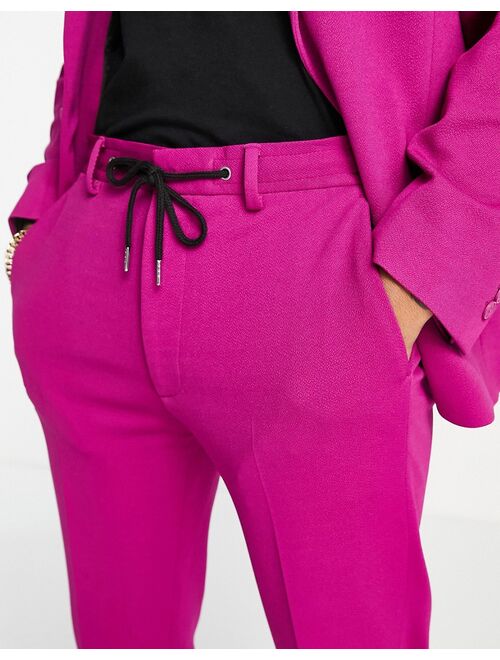 ASOS DESIGN super skinny suit pants with sweatpants waist in pink crepe