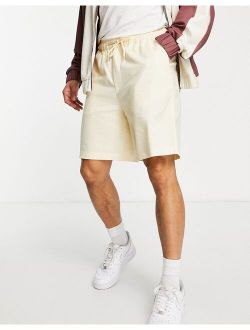 linen boxy shorts in pastel yellow