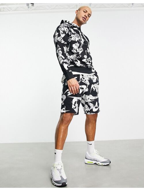 Nike Club Fleece all over logo print shorts in black
