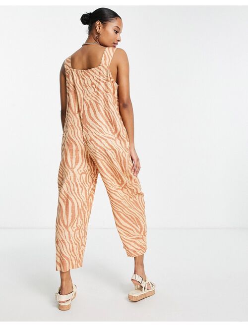 ASOS Petite ASOS DESIGN Petite linen button strap jumpsuit in animal print